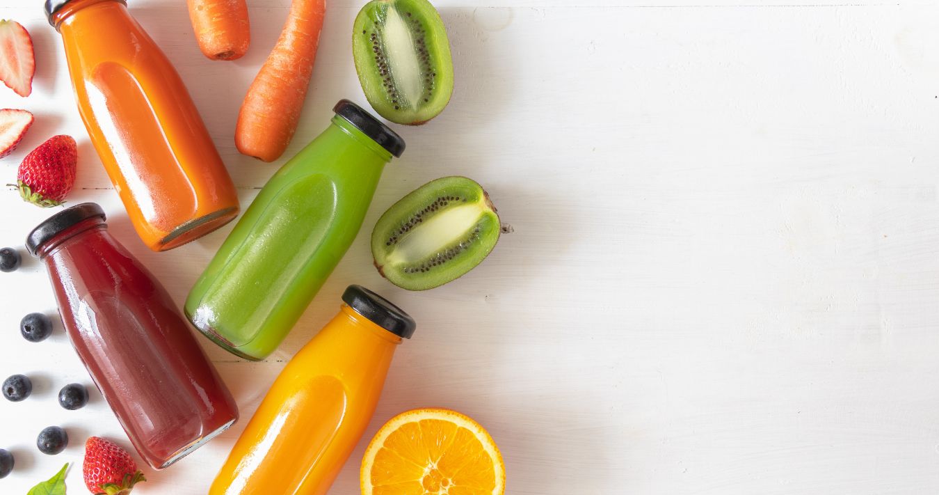 Different fruit juices in bottles